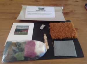 Create a needle felt picture of a moorland scene